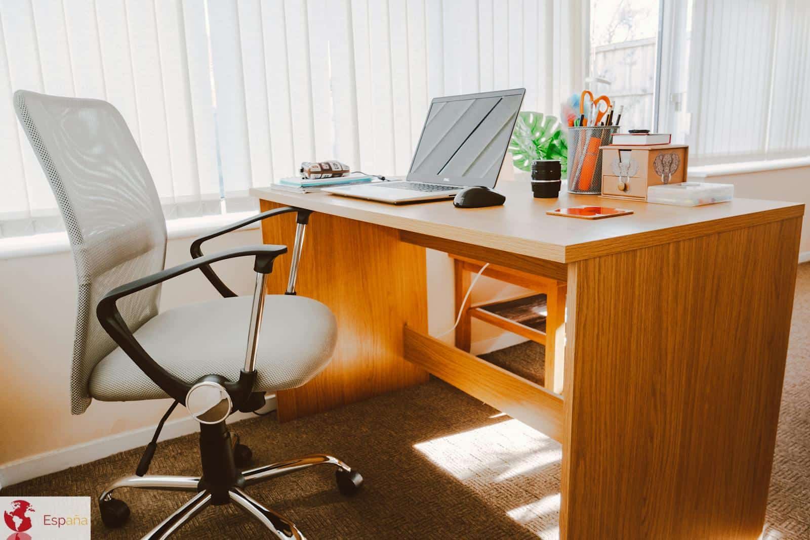 White Rolling Armchair Beside Table